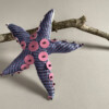 Made from necktie and a placemat, with embellishments cut from a vinyl tote bag. Inspired by a workshop at @textileartsite with @jessica_rosestitch, a wonderful textile artist who makes “sequins” out of repurposed materials.
There are over 1900 species of sea star. It’s entirely possible that there’s one that looks like this.